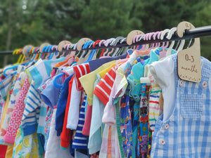 Second-hand children's clothes on a clothing rail